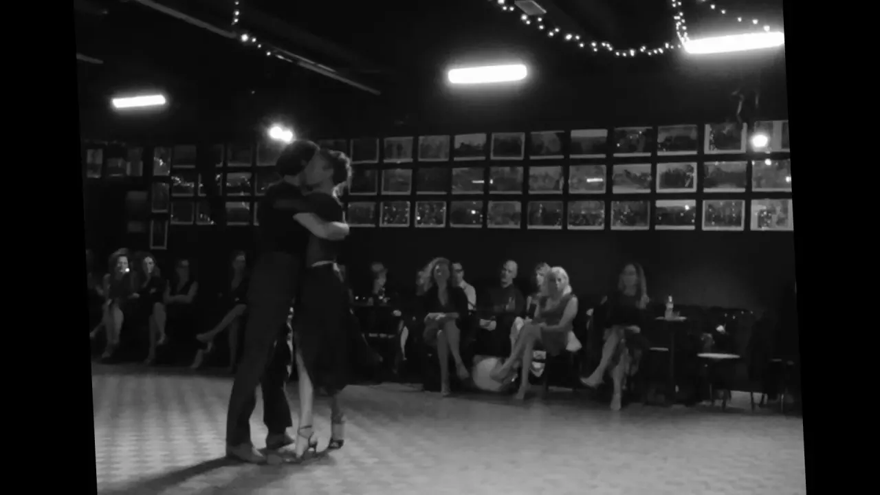 Couple dancing tango at a milonga